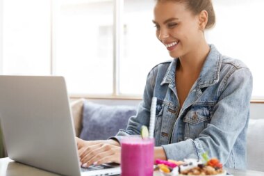Woman in stylish denim jacket in coffee shop