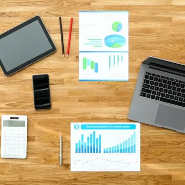Paper with business chart on wooden office table